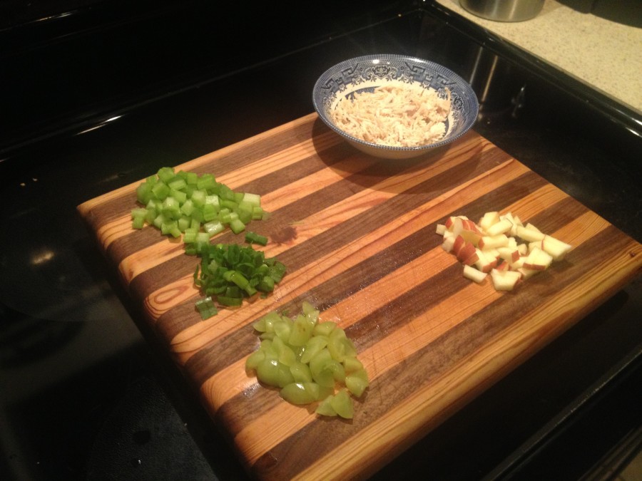 dice celery, green onion, grape, and apple and shred chicken