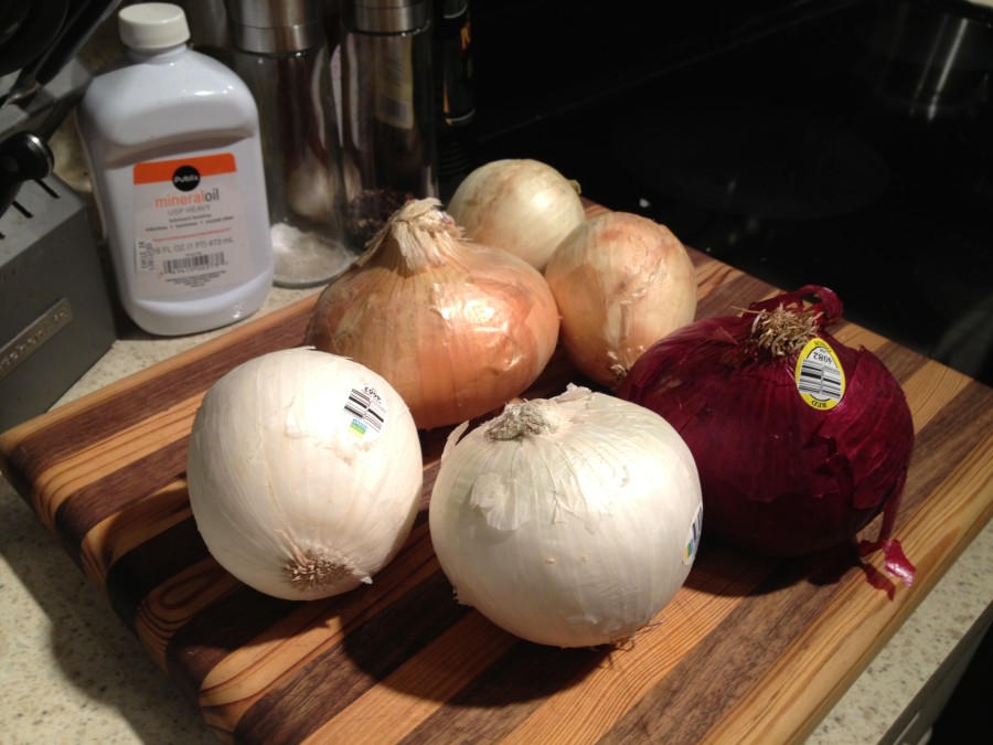 pick up six onions. here we have 2 white, 2 yellow, one sweet, and one red onion
