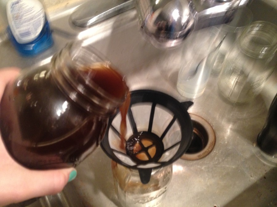 Action Shot! a.k.a. Blurry Shot. Carefully pour the coffee out of the Mason jar number one into mason jar number two through the filter. 