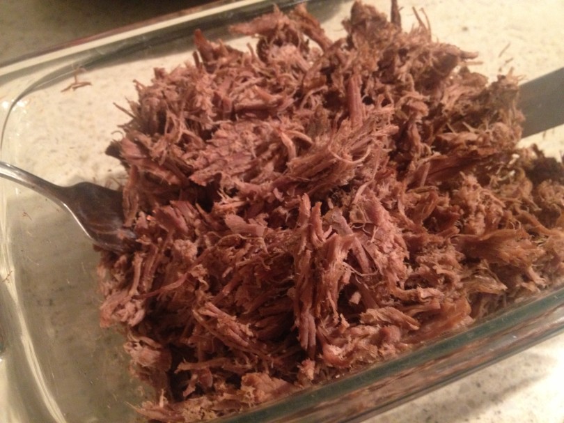 remove from crock pot and shred [it's a little harder to shred than crock pot chicken, but not too bad]